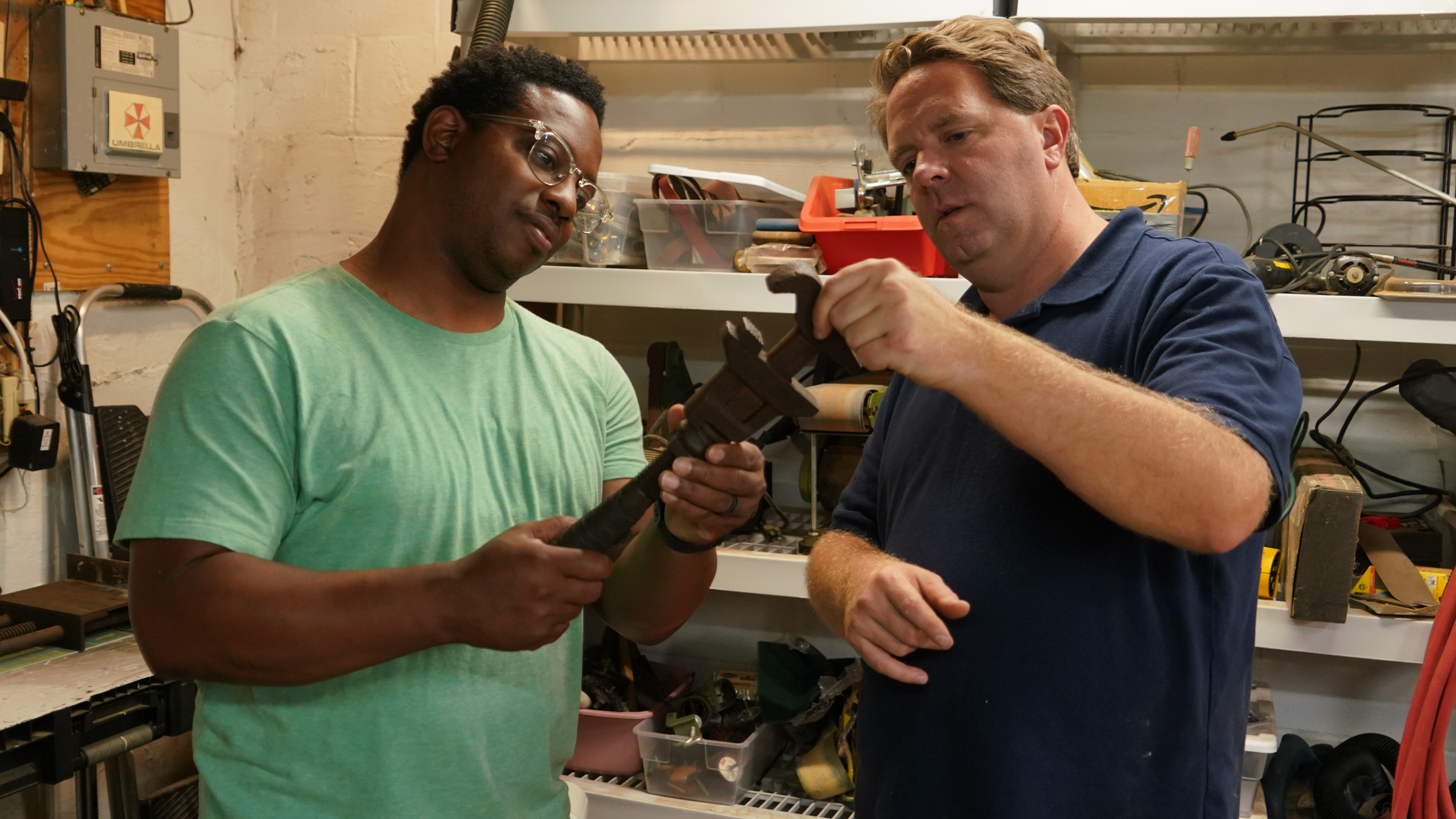 Avi Hopkins (left) and Matt Paxton (right) inspect a wrench found in a Texas home. Photo Credits: Matthew Torti